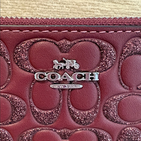 Coach Maroon Poppy Embossed Wristlet - Picture 2 of 7